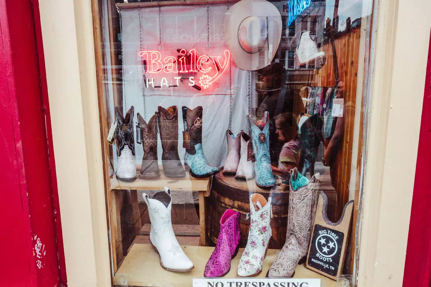 Window of store filled with Cowboy boots