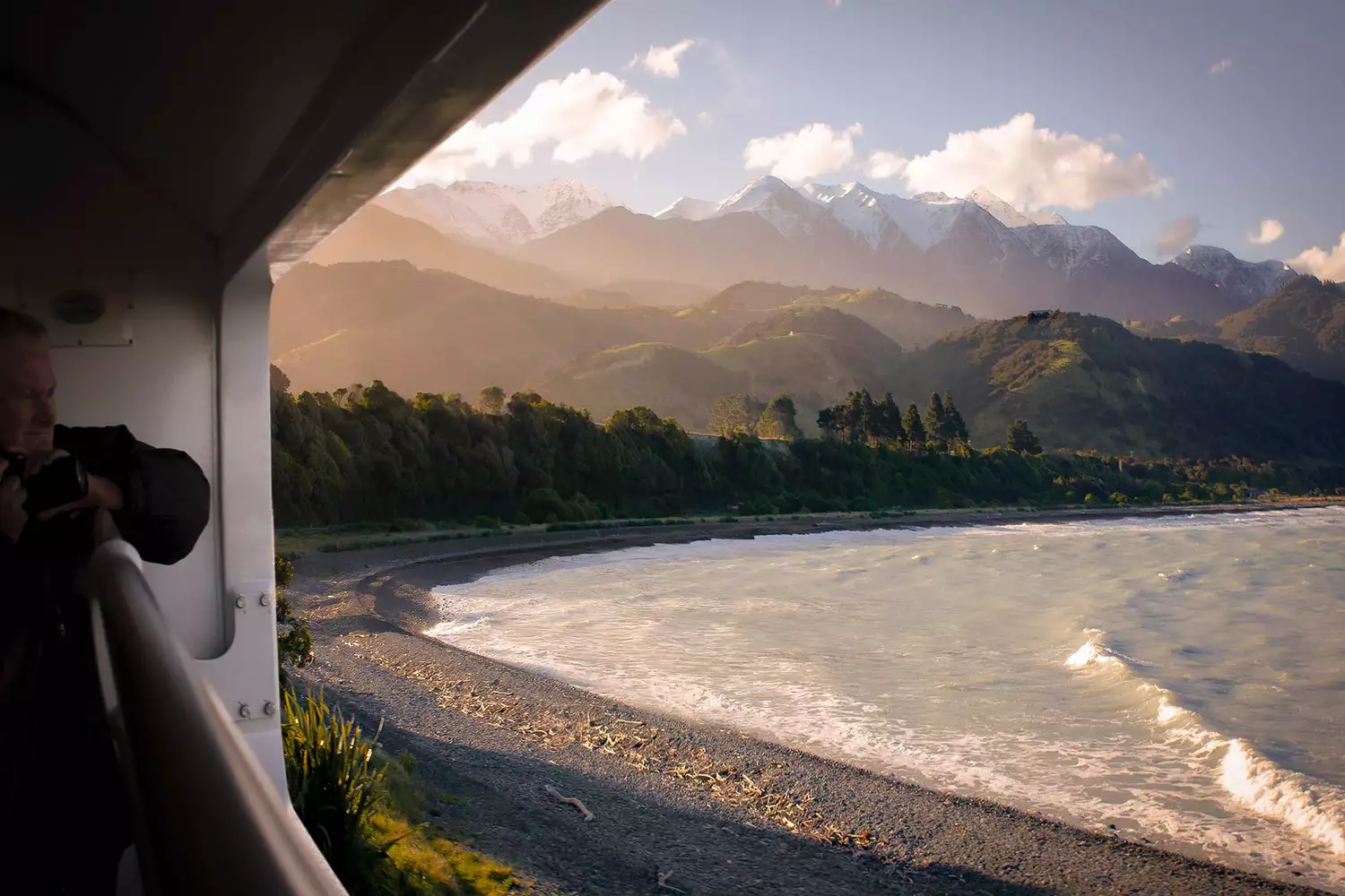 Coastal Pacific train curving around Mangamaunu Bay in New Zealand 