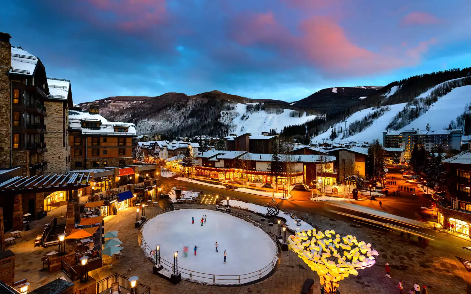 Colorful sunset over ice skating rink in Vail