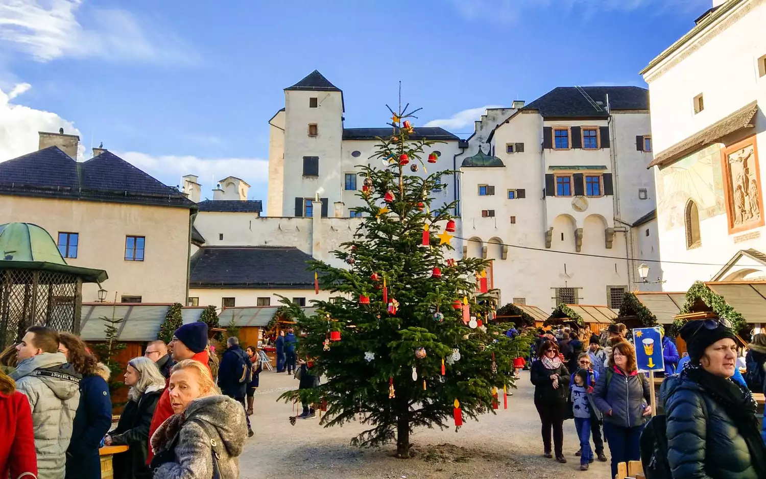 Shoppers browse the stalls of a Christmas market in Salzburg.