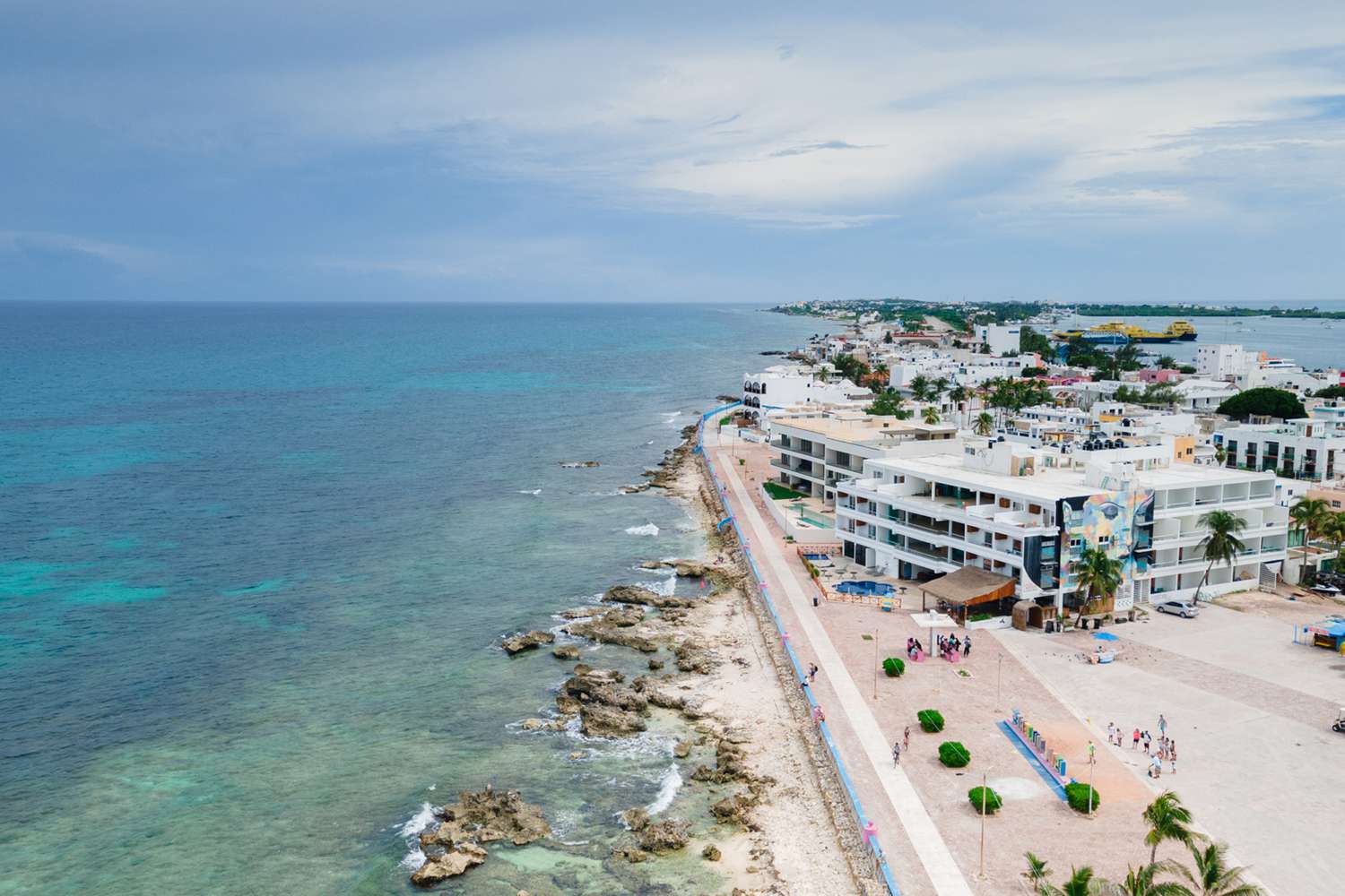 Aerial view of buildings along the coast of Isla Mujeres